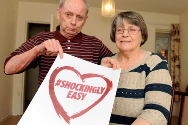 John and Betty Geddes show their support for our defibrillator campaign. Picture: Lisa Ferguson