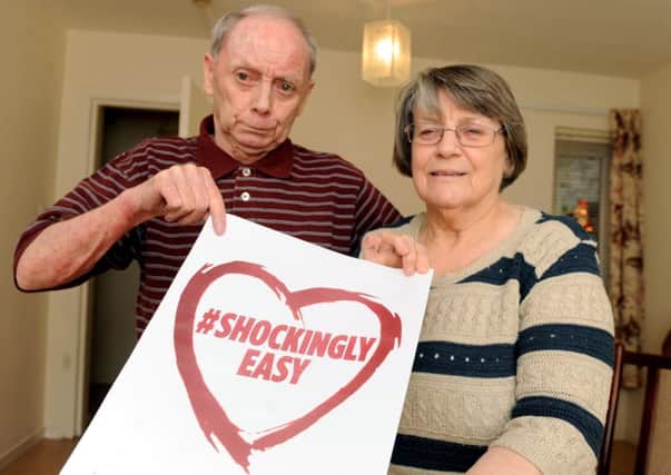 John and Betty Geddes show their support for our defibrillator campaign. Picture: Lisa Ferguson