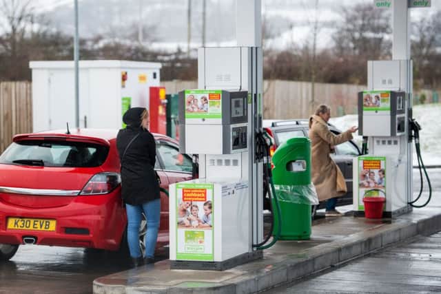 Drivers fill up at the Asda Straiton fuel pumps. Pic: Ian Georgeson