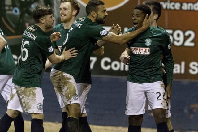 Hibernian's Dominique Malonga (right) celebrates having put his side 1-3 ahead. Picture: SNS