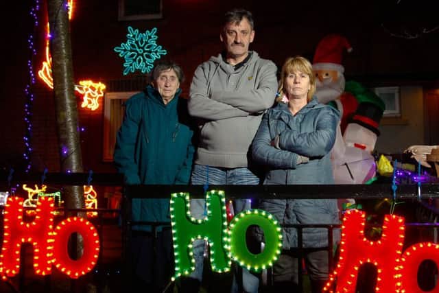 Jeanie Gowans, Tam Thomson and Donna Pearson are unimpressed with warnings from their landlord about Christmas decorations. Picture: Scott Louden