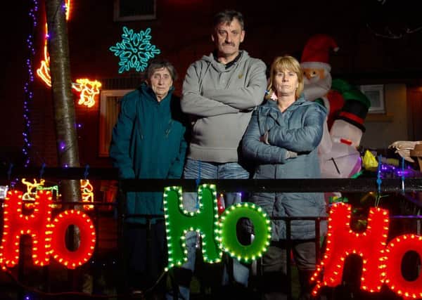 Jeanie Gowans, Tam Thomson and Donna Pearson are unimpressed with warnings from their landlord about Christmas decorations. Picture: Scott Louden