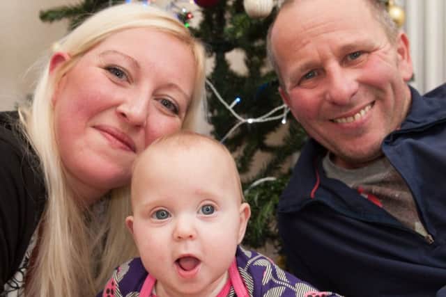 Emily Cressey enjoys her first Christmas at home with mum Claire and dad Alan. Picture: Phil Wilkinson