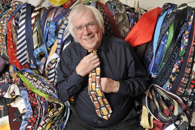 Joe Higgison shows off his amazing collection of weird and wonderful ties  more than one for every day of the year. Picture: Phil Wilkinson