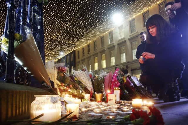 Candle and floral tributes left near the Gallery of Modern Art in Glasgow. Picture: PA