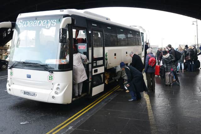 Passengers are moved on to buses at Edinburgh Waverley. Pic: Neil Hanna