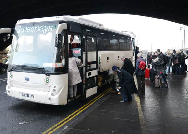 Passengers are moved on to buses at Edinburgh Waverley. Pic: Neil Hanna