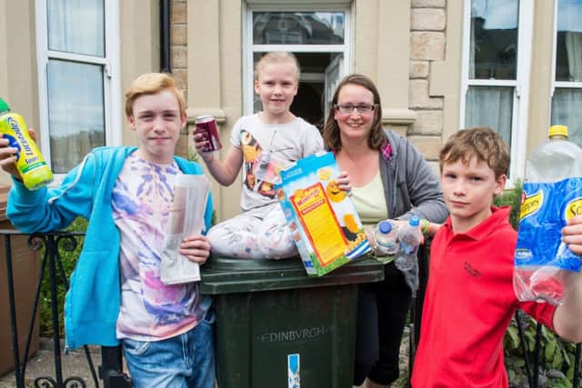 Mum Rebecca McCombe with kids Aaron, 13, Samuel, 11, and Naomi, eight show theyve got the message. Picture: Ian Georgeson