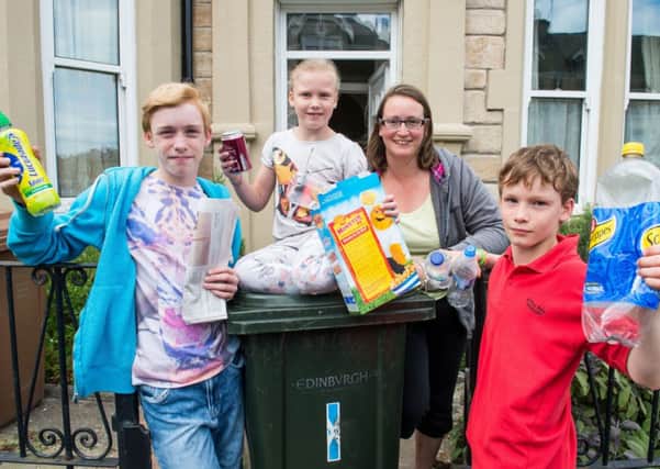 Mum Rebecca McCombe with kids Aaron, 13, Samuel, 11, and Naomi, eight show theyve got the message. Picture: Ian Georgeson