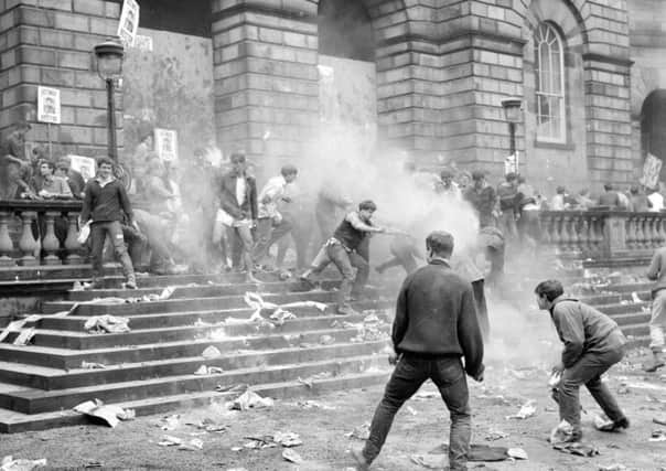 Flour and rotten fruit fly during a rectorial battle in the Old College Quad in 1959. Picture: TSPL