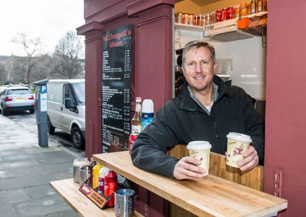 John McDougall has set up a doughnut bar in a former police box on Drumsheugh Gardens. Picture: Ian Georgeson
