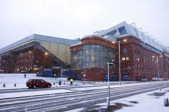 Ibrox Stadium in Glasgow as snow falls before the Scottish Championship match. Pic: PA Wire