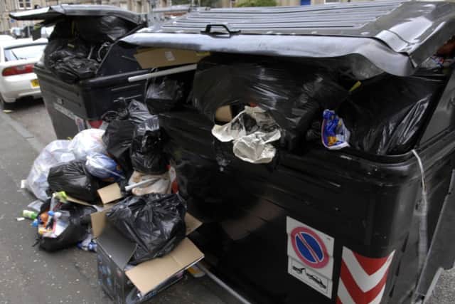 Leaving a bag next to a bin can incur a £200 fine. Picture: Kenny Smith