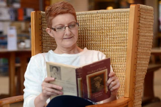 Angie reads the biography of Elsie Inglis, Shadow of Swords. Picture: Neil Hanna