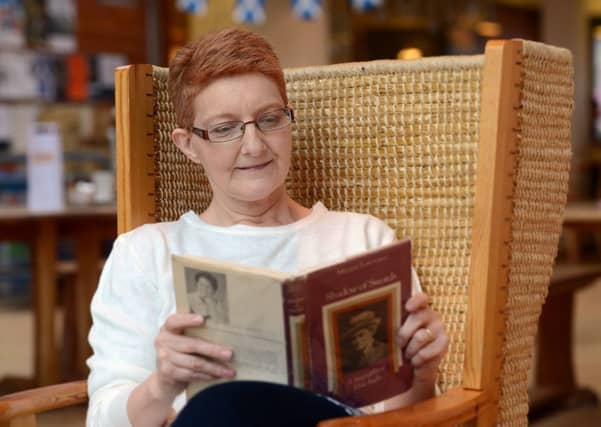 Angie reads the biography of Elsie Inglis, Shadow of Swords. Picture: Neil Hanna