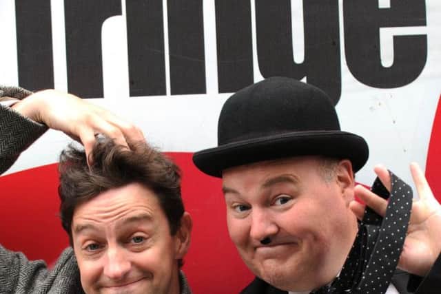 Tony Carpenter and Philip Hutchinson as Laurel and Hardy on Edinburgh's High Street during the Fringe Festival. Pic: Jane Barlow