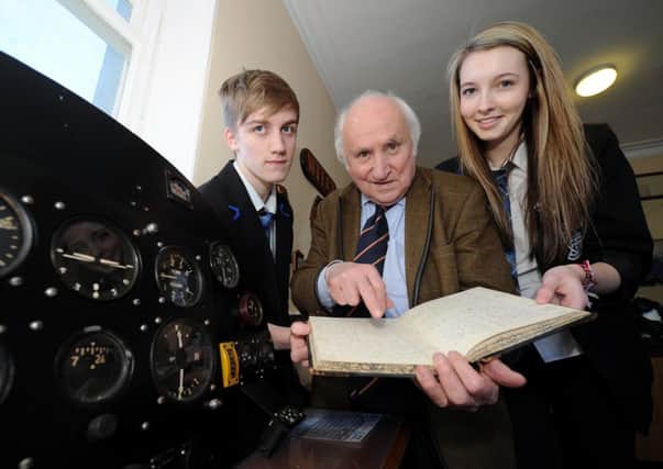 Richard Demarco shows Queensferry High pupils David Yule and Amy Ferguson the exhibits. Picture: Lisa Ferguson