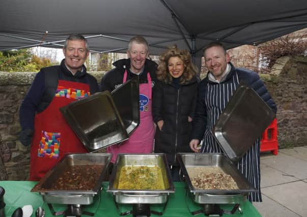 Gavin Hastings, John Jeffrey and Andy Nicol cook up a storm with Olivia Giles. Picture: Toby Williams