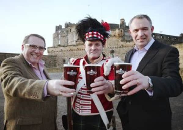 Stephen Duncan of Historic Scotland and Andy Maddock of Caledonian Brewery toast the beer. Picture: Comp