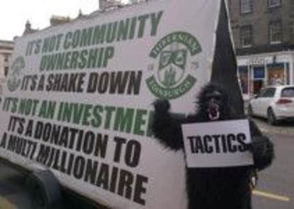The Hibs fan makes his protest. Picture: Jim Slaven