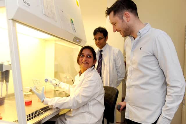 Gordon Aikman chats with Professor Siddharthan Chandran and technician Rinku Rajar at the Euan MacDonald Centre. Picture: Lisa Ferguson