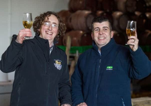 Peter Stuart and Asda's Brian O'Shea toast their new deal. Picture: Ian Georgeson