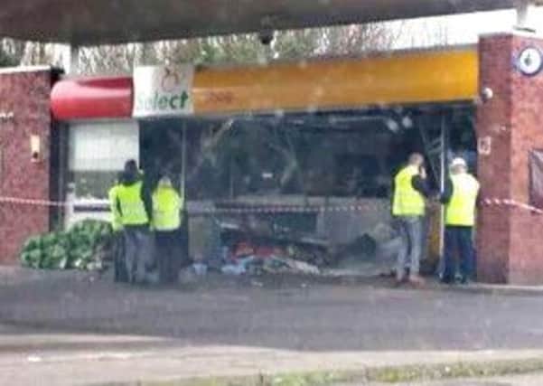 The scene of devastation after the learner's car ploughed into the garage shop. Picture: Alex Lawrie