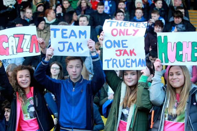 Spectators pay tribute to Jak Trueman at the match. Picture: Gordon Jack