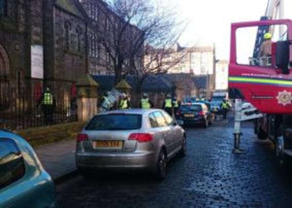 Riot police exit the church. Picture: Kaye Nicolson