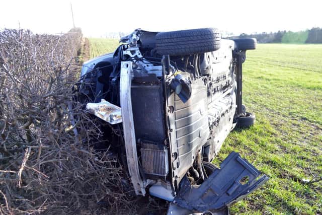 The overturned car that the firefighters were responding to. Picture: Jon Savage