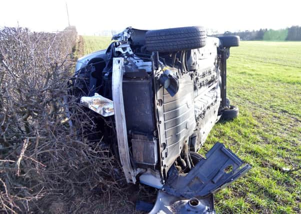 The overturned car that the firefighters were responding to. Picture: Jon Savage