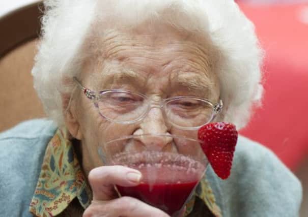 Margot Cameron, 95, enjoys her cocktail at Cluny Care Home. Picture: Jane Barlow