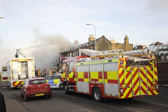 Firefighters tackle the Seaview Terrace blaze. Picture: Greg Macvean