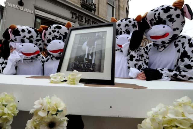 Mourners turn out in droves for plastic cow's funeral. Picture: Lisa Ferguson