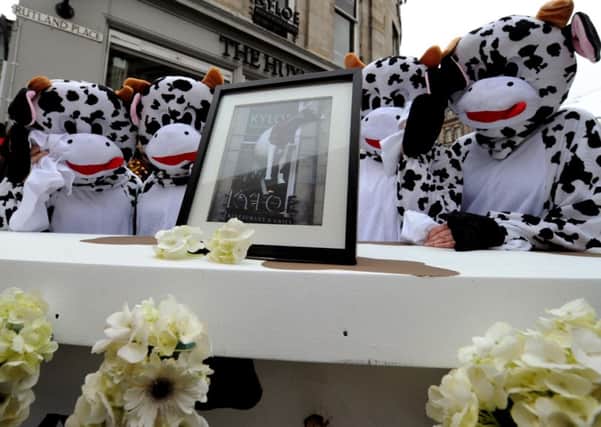 Mourners turn out in droves for plastic cow's funeral. Picture: Lisa Ferguson