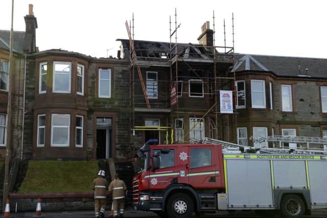 The fire started in the roof of 4 Seaview Terrace then spread to No.5 Picture: Julie Bull