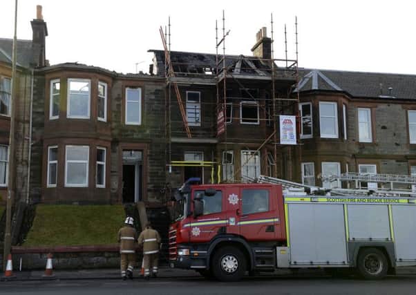 The fire started in the roof of 4 Seaview Terrace then spread to No.5 Picture: Julie Bull