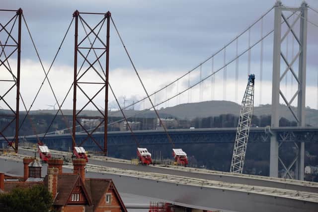 The new crossing takes shape with the old bridge in the background. Picture: Jeff J Mitchell/Getty
