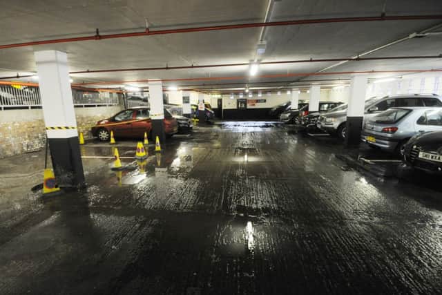 Sewage spreads across the floor in the St James Centre car park. Picture: Greg Macvean