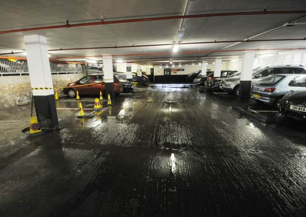 Sewage spreads across the floor in the St James Centre car park. Picture: Greg Macvean