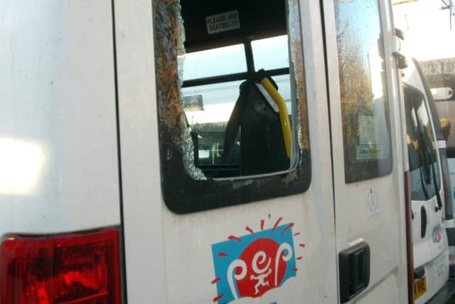The shattered rear window of one of the minibuses. Picture: comp