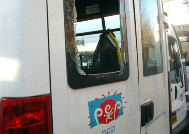 The shattered rear window of one of the minibuses. Picture: comp