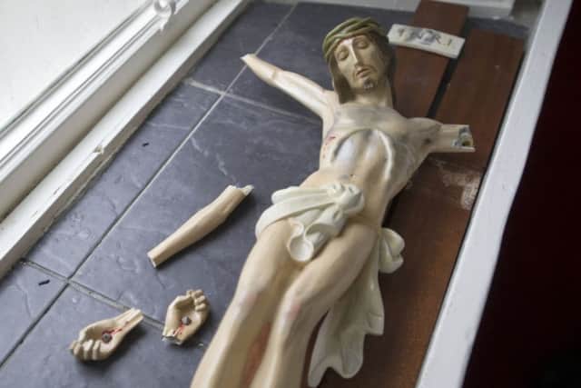 A crucifix was shattered during the break-in. Picture: Jane Barlow