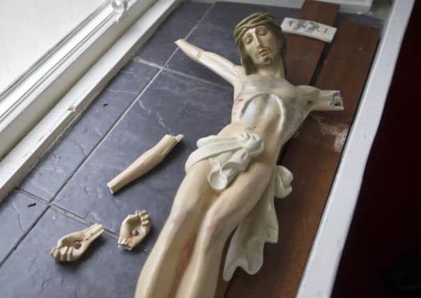 A crucifix was shattered during the break-in. Picture: Jane Barlow