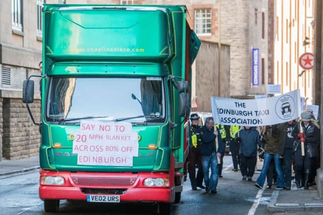 Campaigners on foot and in vehicles march through the Cowgate to the Grassmarket. Picture: Ian Georgeson