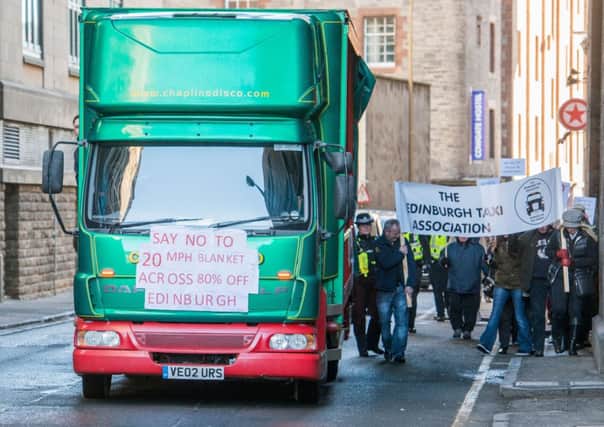 Campaigners on foot and in vehicles march through the Cowgate to the Grassmarket. Picture: Ian Georgeson