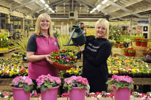 Dobbies community champion Jayne Kirkpatrick celebrates with Jamie Skinners cousin Karen Greechan after a book signing event raised £500 for the Jamie Skinner Foundation. Picture: Greg Macvean