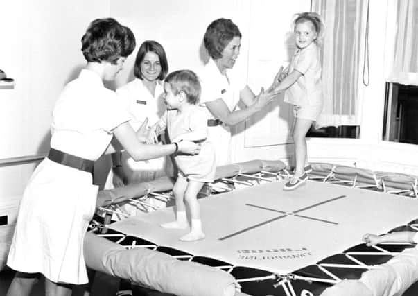 Trampolines are used at the physiotherapy department of the Sick Kids hospital in 1968; below, soldiers take it easy during Tattoo rehearsals at Redford Barracks in 1979