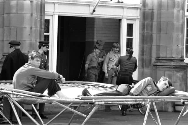 Two teenage soldiers at Redford Barracks, pictured in 1979, from the Junior Leaders regiment rest on their trampoline. Picture: Denis Straughan