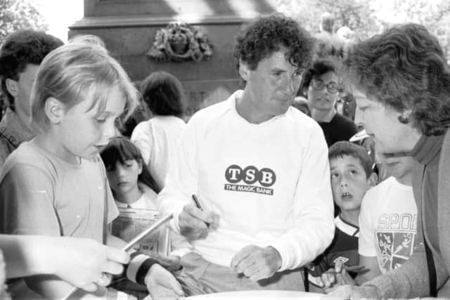 Michael Palin signs autographs when he opens the Children's Book Fair at the Edinburgh Book Festival 1987.